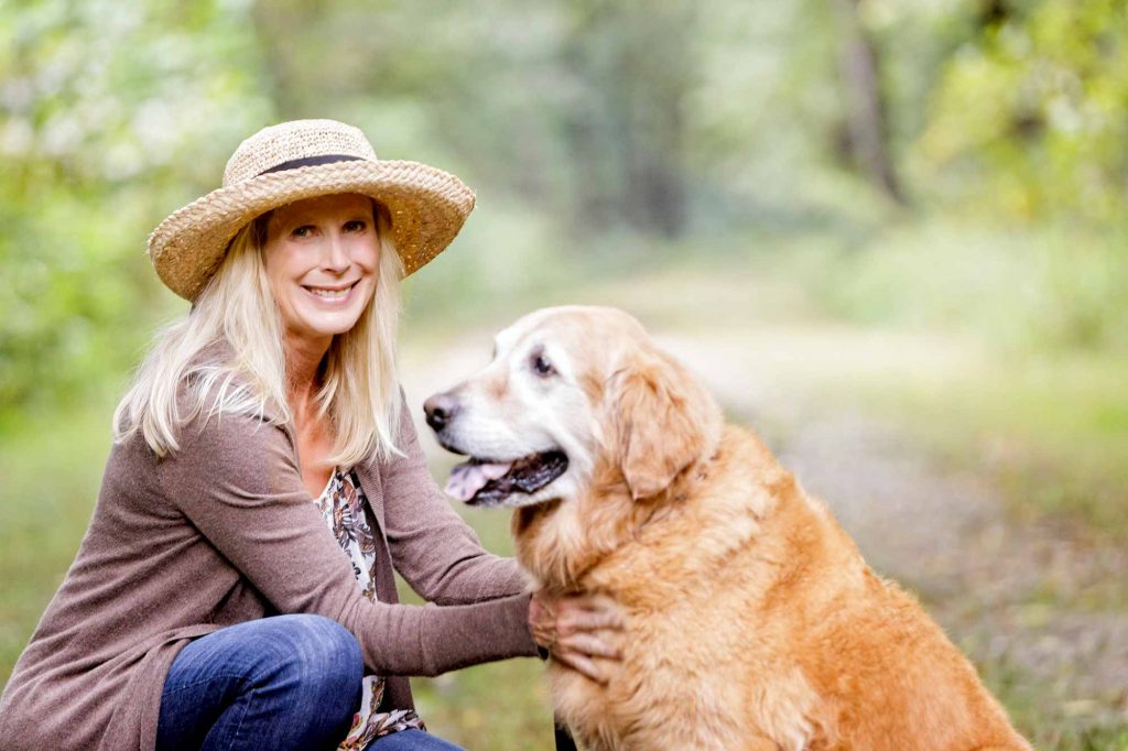 A woman with her older dog